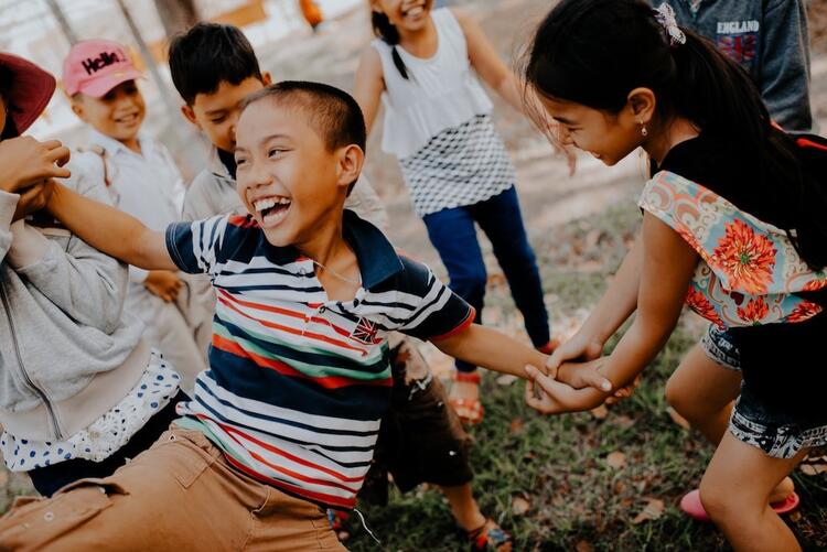 Young children laughing and playing