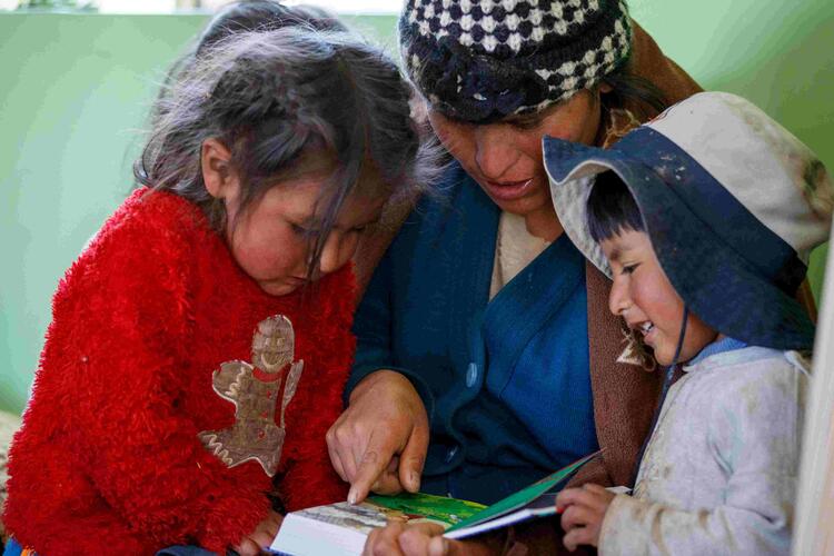 South American mom with 2 kids reading, Marc Ewell